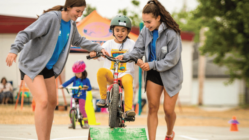Pedalheads Associates Teaching Kid to Ride